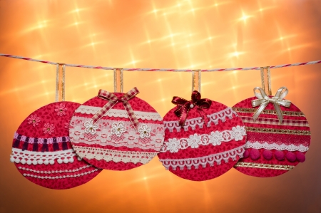 Colorful Christmas baubles on glitters yellow background with copyspace の写真素材