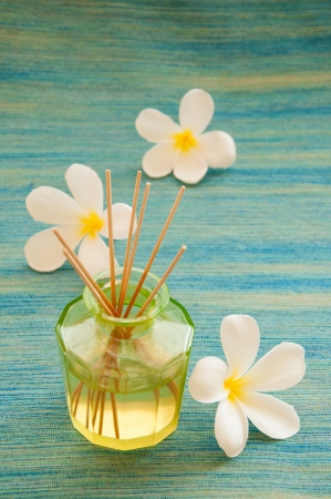 Bottle of fragrance reeds diffuser wih frangipani flowers の写真素材