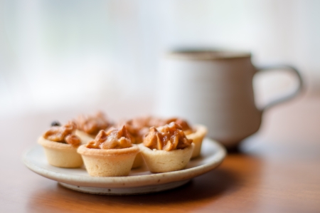 Cashew tart on serving plate   Focus with a cashew tart の写真素材