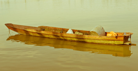 unused boat on the riverの写真素材