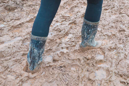 Rain boots in the mud