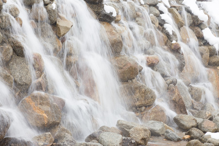 waterfall with snowの写真素材