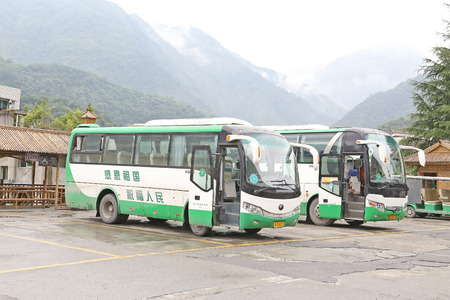 BEICHUAN, CHINA - 28 June, 2014: green travel bus before the BEICHUAN earthquake at tourist center.のeditorial素材
