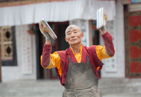 TIBET,CHINA - Aug 16,2013: Monk on the street at Tibet, China.のeditorial素材