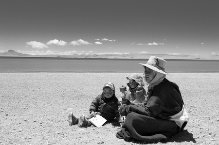 Woman sitting with her childrenのeditorial素材