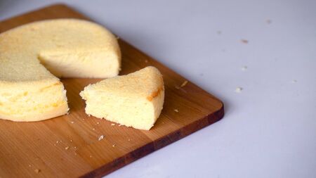 yellow sponge cake display on wooden boardの写真素材