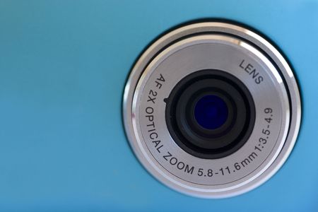 Isolated digital camera lens over blueの写真素材