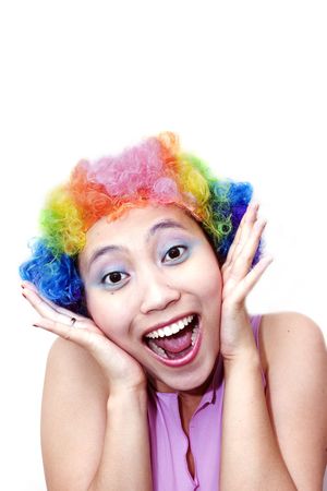 Young asian woman with clown wigの写真素材
