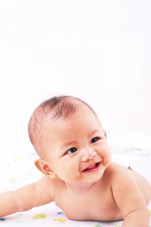 Cute baby smiling and laughing over white background