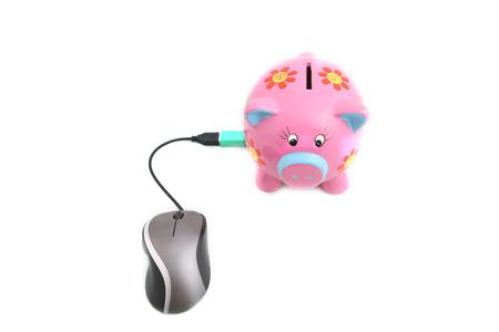 Isolated computer mouse and Piggy bank shot over white background.の写真素材