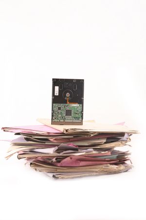 Isolated stack of folders with hard-disk shot over white background
