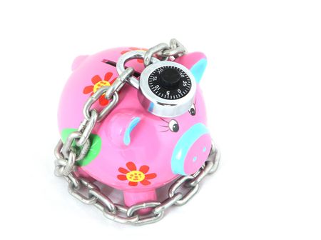 Locked piggy bank isolated over white backgroundの写真素材