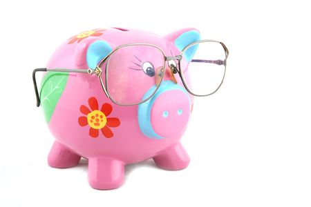 Piggy bank wearing glasses isolated over whiteの写真素材