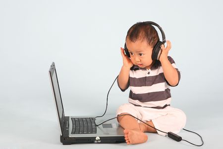  with headphone listens to a classical songの写真素材