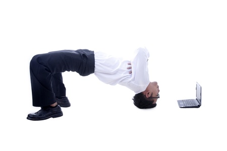 Young asian businessman with his acrobatic movesの写真素材