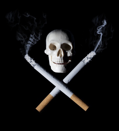 Two cigarettes with skull - danger of smoking conceptの写真素材