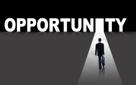 Businessman walks toward an opportunity doorの写真素材