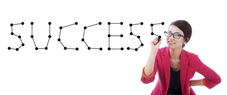 Businesswoman connecting the dots making the word successの写真素材