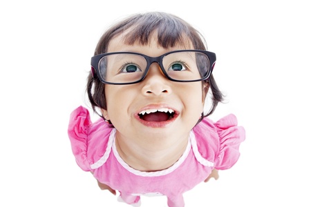 Closeup of funny female preschooler in pink dress. shot in studio isolated on white