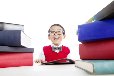 Portrait of elementary school student reading books. shot in studioの写真素材