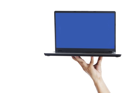 Hand holding laptop computer with blank screen isolated on whiteの写真素材