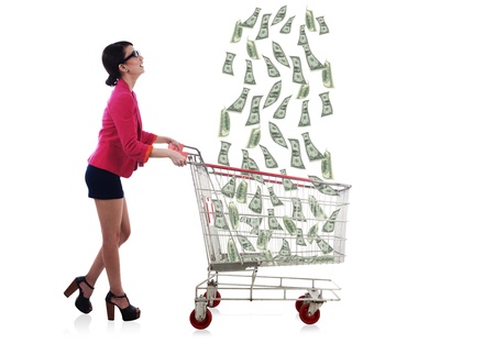 Lucky businesswoman catching raining money by using shopping cartの写真素材