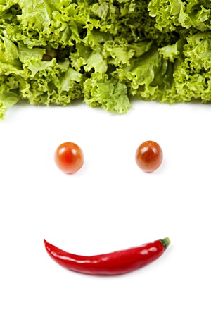 Face made out of different vegetables, shot in studio isolated on white backgroundの写真素材