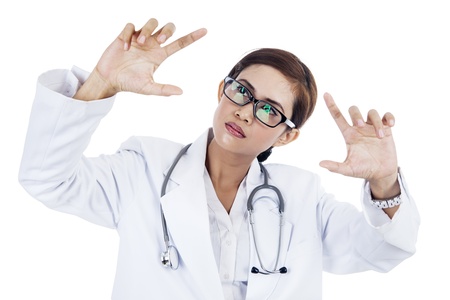 Portrait of asian female doctor with hand gesture  isolated on whiteの写真素材