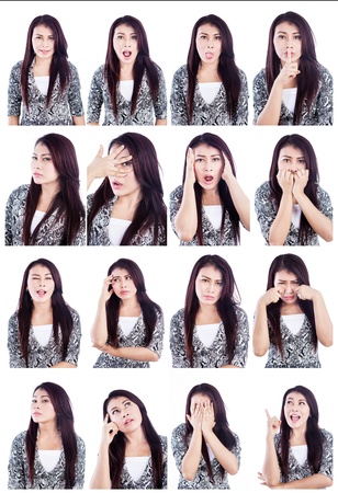 Multiple facial expressions of beautiful Asian woman isolated over whiteの写真素材