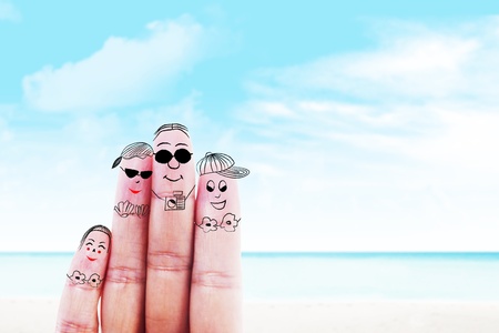 Fingers gesturing as family members that travels at the beachの写真素材