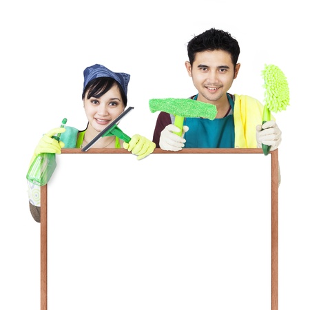 Cleaning service couple holding copyspaceの写真素材