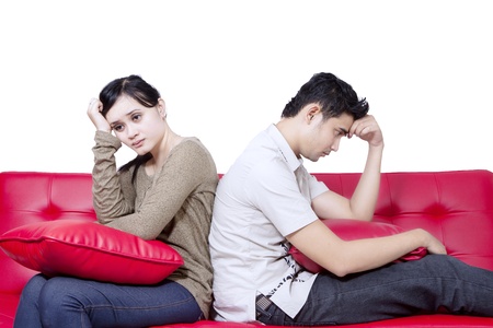 Asian couple having a cold fight on white backgroundの写真素材