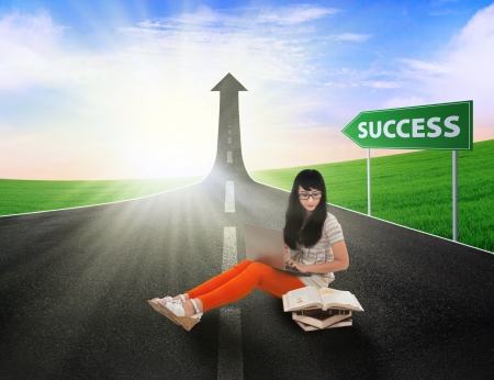Asian female student reading books on the road to success Asian female student reading books on the road to success
