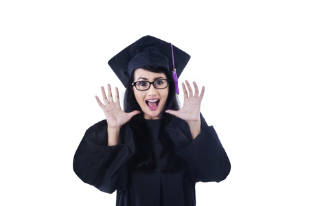 Excited female graduate shouting on white background