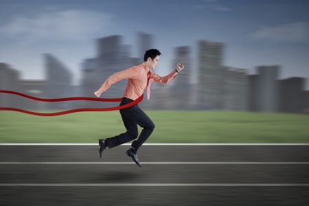 Asian businessman winning in business competitionの写真素材