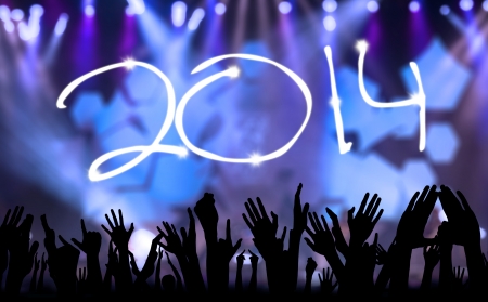 Symbol of happy new year 2014 with silhouette handsの写真素材