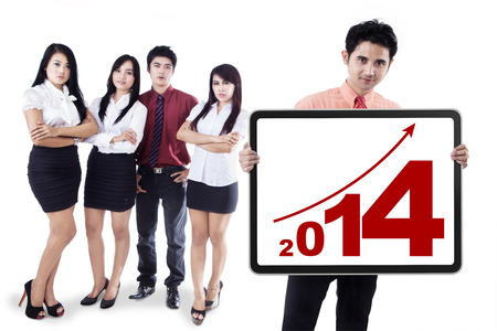 Group of business people showing the new year 2014の写真素材