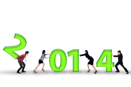 Group of businesspeople is trying their hardest to improve results in 2014の写真素材