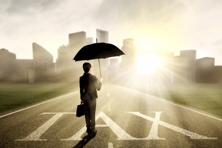 Business woman walking on the highway into cityscapeの写真素材