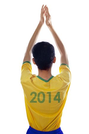 Backside of passionate brazilian fans clapping hands isolated on white backgroundの写真素材