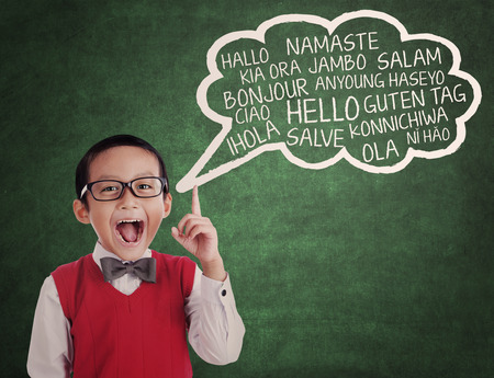 Education concept: schoolboy learn universal language at class Education concept: schoolboy learn universal language at class