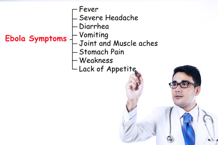 Doctor writes Ebola symptoms on whiteboard, isolated on white backgroundの写真素材