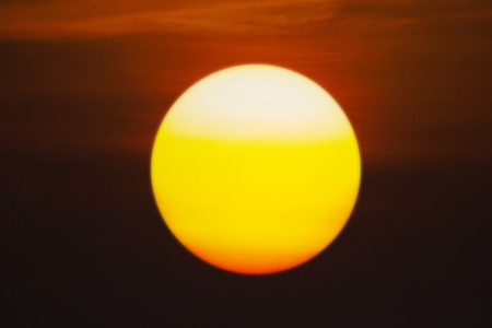 Beautiful sunset with golden sun at duskの写真素材