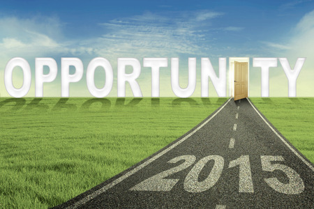 Road with number 2015 and an opportunity door, symbolizing the way to get an opportunity in the futureの写真素材