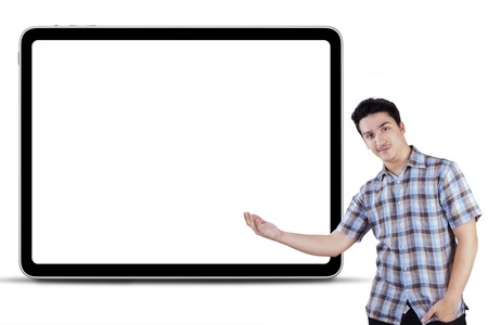 Portrait of young caucasian person showing empty copy space, isolated over white background