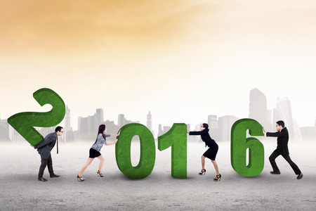 Image of business team work together to arrange numbers 2016 outdoorsの写真素材