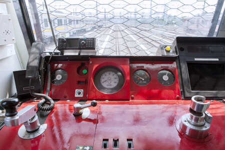 Image of empty control panel inside commuter trains, shot in the machinist room