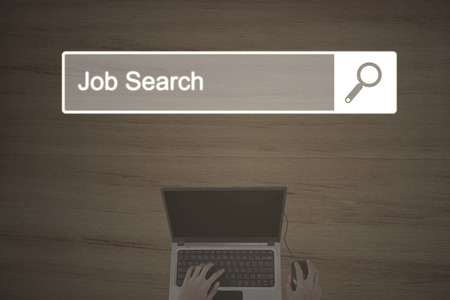 Concept of Job Search with browser page and businessman hand working on the laptopの写真素材