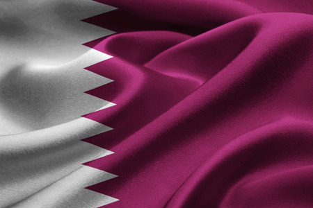 Close up of Qatar flag waving in the windの写真素材