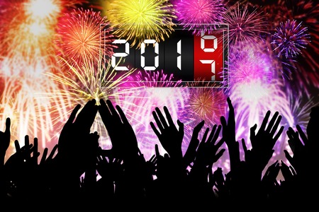 Silhouette of hands people is celebrating the new year in the carnival while watching fireworks and count down the timeの写真素材